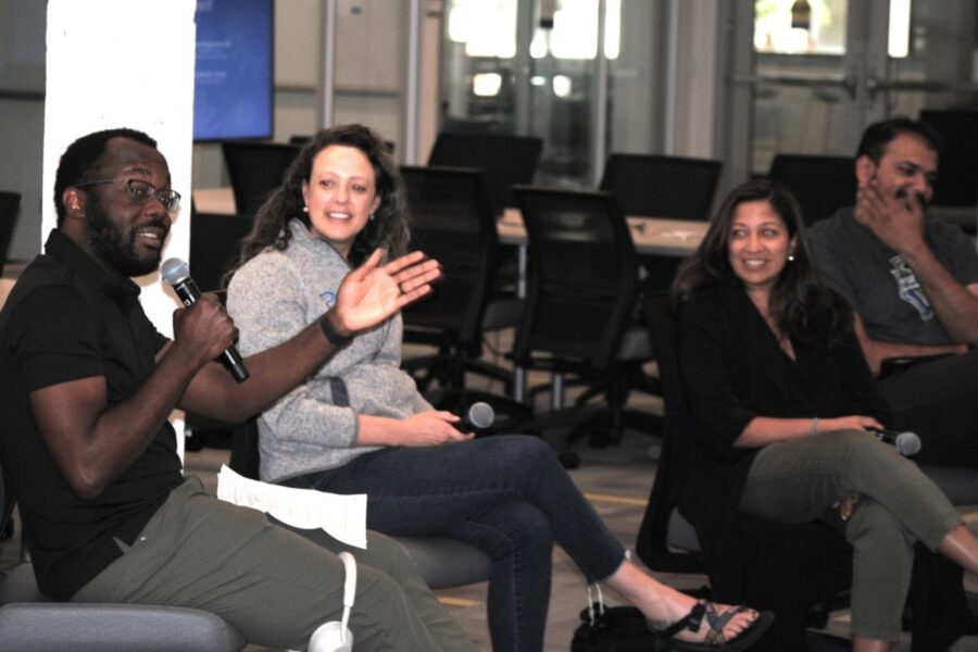 Ayokunle Olanrewaju, Ph.D., (left) addresses interns from UW Medicine, Fred Hutch, and Seattle Children's, as (left to right) panelists Lea Starita, Ph.D., Alpana Waghmare, M.D., and Riddhiman Garge, Ph.D. look on.
