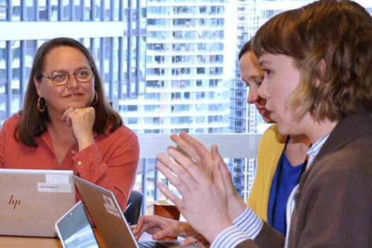 The ACT Center’s Jessica Ridpath (L) and Sunday Brush (R) lead a discussion with their team about updating the Checklist for Inclusive Communications.