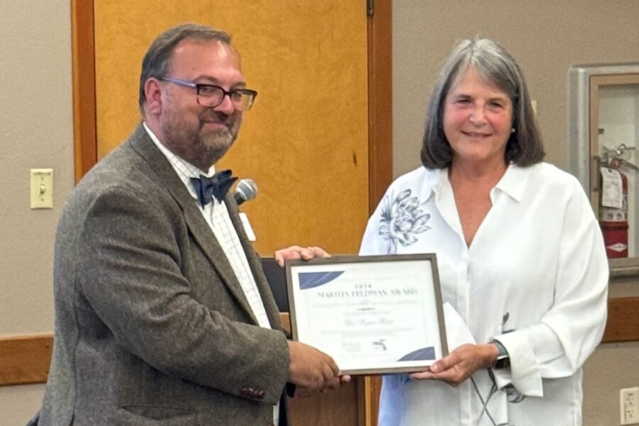 Dr. Rose accepts the award from ORCA President Dave Hammond